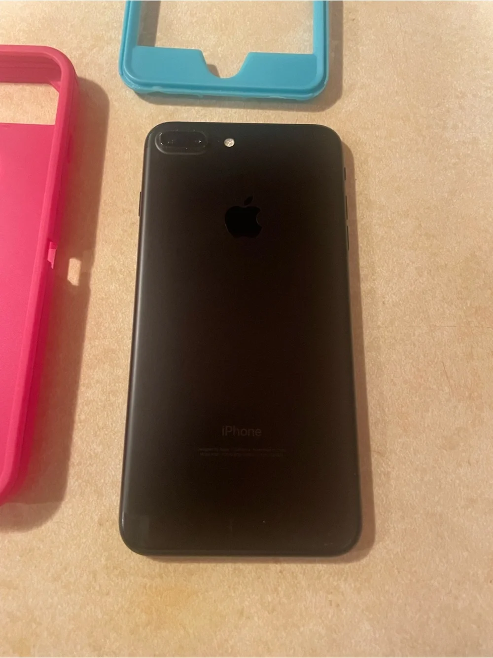 Apple IPhone 7 Plus with Pink and Teal Protective Phone Case with Front Frame.